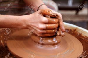 9494255-clay-potter-hands-closeup-working-on-wheel-handcrafts-pottery-work-Stock-Photo